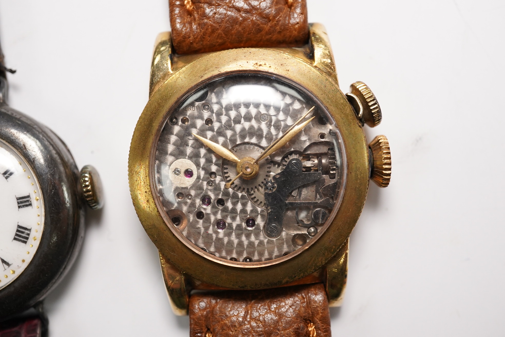 A gentleman's 1940's 10k gold filled Longines Weems? manual wind wrist watch, lacking dial, case diameter 28mm, together with a lady's silver wrist watch. Condition - poor to fair